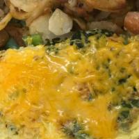 Vegetarian Omelet · Tomatoes, onions, mushrooms, bell peppers, spinach, and cheese. Prepared with three eggs. Se...