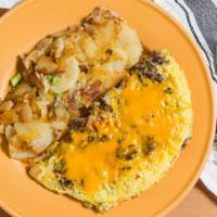Goldenwest Omelet · Ground beef, Ortega chiles, tomatoes, onions, and cheese. Prepared with three eggs. Comes wi...