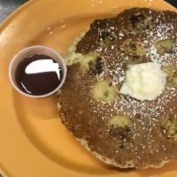 Banana Pancakes · Two pancakes served with side of butter and maple syrup.
