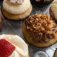 The Assortment (Cupcakes) · A yummy collection of one dozen cupcakes. (Assortment will vary, may contain nuts.)