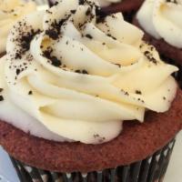 The Red Velvet · Red velvet cake topped with vanilla buttercream and cookie crumbs.