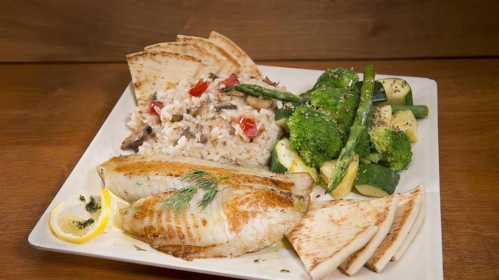 Salmon Plate · Grilled fresh salmon fillet served with risotto, steamed veggies, pita bread, and a drizzle of our cilantro lime vinaigrette.