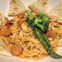 Jambalaya Pasta · Sautéed Louisiana sausage, shrimp, bell peppers, mushrooms, onions, and garlic, tossed with ...