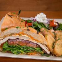 Ciabatta Chicken · Grilled chicken breast, swiss cheese, baby greens, red onions, tomatoes, chipotle spread, ci...