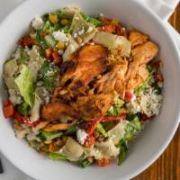 Grilled Salmon Salad · Romaine lettuce, artichoke hearts, corn, peas, feta, sundried tomato and pine nuts with bals...