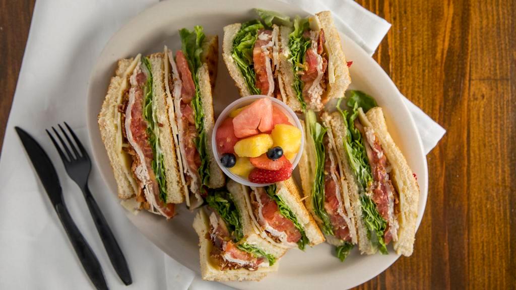 Club Tri-Decker · Lettuce, tomato, oven-roasted turkey, bacon and Swiss hot pastrami.