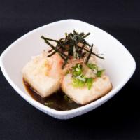 Agedashi Tofu · Deep-fried tofu with grated radish, ginger, green onion, dried bonito flakes, and seaweed.