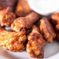 Chicken Wings · 9 pieces of Buffalo Chicken Wings. Served with a side of creamy dressing for dipping!