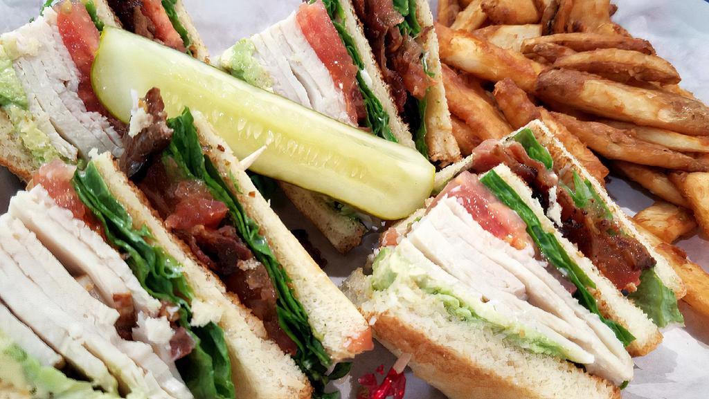 Club Sandwich · Triple decker toasted white bread, turkey, bacon, lettuce, tomato, and mayonnaise.