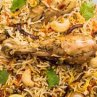 Chicken Biryani · Basmati rice cooked with marinated chicken pieces and spices.