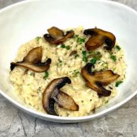 Risotto Truffle And Porcini Mushroom  · Arborio Rice Risotto, white wine and shallots with Truffle oil Sauce