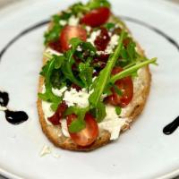 Italian Toast  · Multigrain Bread, Goat cheese, Tomatoes, Sun-Dries tomatoes, homemade pesto, pine nuts and a...