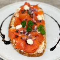 Salmon Toast  · Multigrain bread, Cream Cheese, Arugula salad, Red onions, Capers, Smoked Salmon and lime ma...