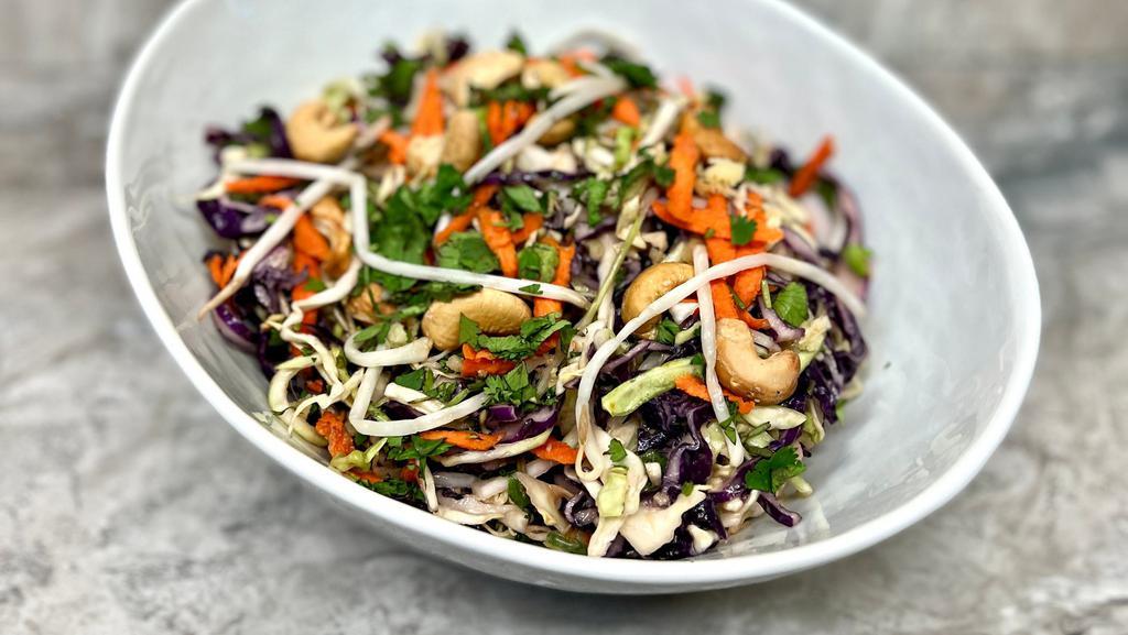 Asian Style Salad  · Red cabbage, Green cabbage, Carrots, cilantro, Cashews, Peanut butter and Sesame dressing