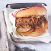 Jucy Lucy · American cheese-stuffed Panko-fried beef and onion patty, house-made pickles, lettuce, tomat...