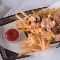 Dad-Bod Fries · Regular or Tangy Fries, Cheese Sauce, House-made Spread, Grilled Onions