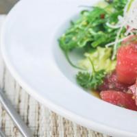 Spicy Tuna Poke Salad · Fresh tuna mixed in a sweet and spicy poke dressing topped with green onions, served with a ...
