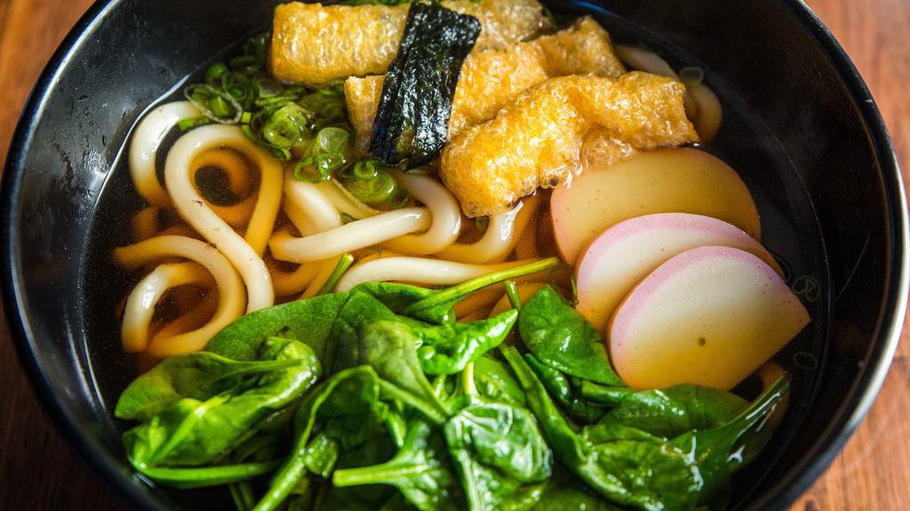Kitsune Udon · Udon noodles, aburaage, fish cake and spinach topped with green onions and seaweed served in a dashi broth