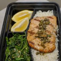 Grilled Salmon With Caper Sauce · Served with white rice and sauteed garlic spinach.