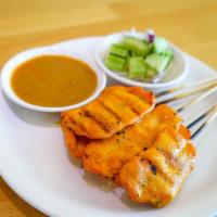 Chicken Satay · 6 pieces. Grilled marinated chicken on skewers served with peanut sauce and cucumber salad.