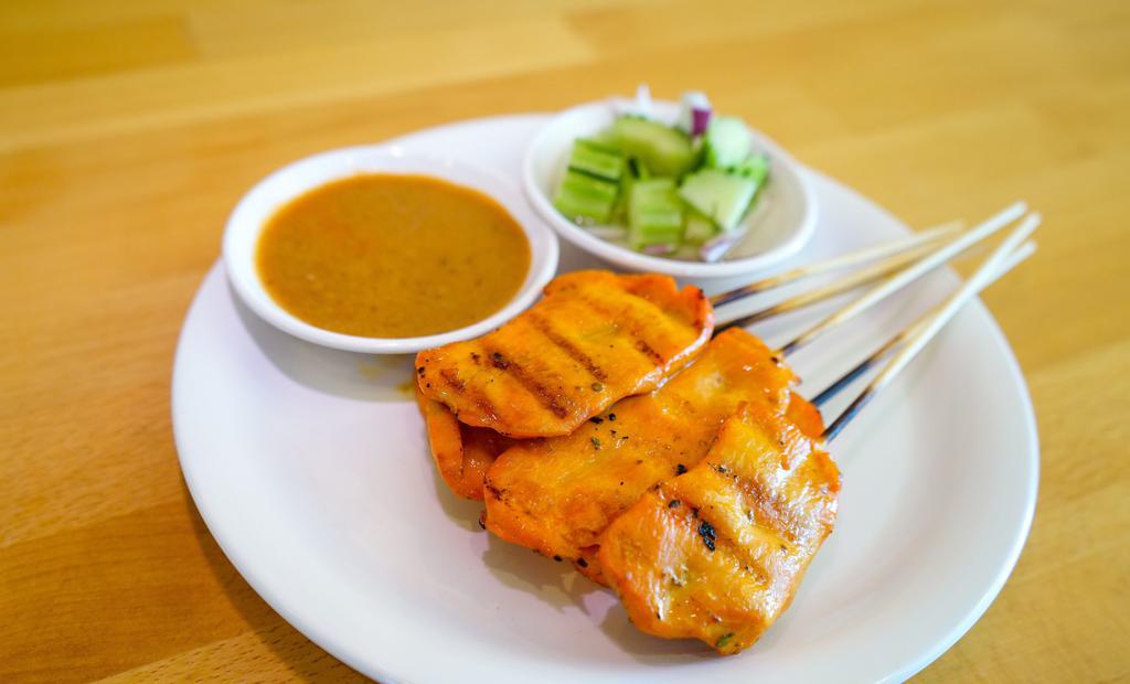 Chicken Satay · 6 pieces. Grilled marinated chicken on skewers served with peanut sauce and cucumber salad.