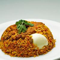 Chicken Biryani · Flavored rice with chicken cooked in special blend of spices.