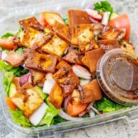 Fattoush Salad · Tomato, cucumber, onions, mint, radish, and topped with seasoned grilled bread and Mediterra...