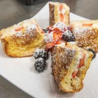 Stuffed French Toast · With strawberries and cream cheese, served with two eggs and bacon.