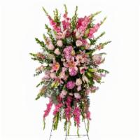Compassion · Pink roses, lilies, and more come together for a blushing pink standing funeral spray.