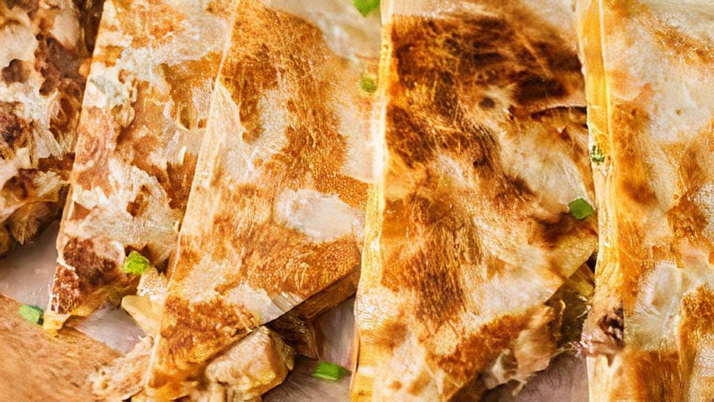 Quesadillas · Flour tortilla with melted cheese and choice of meat.