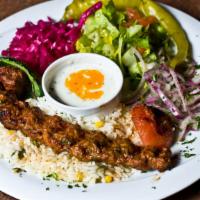 Adana Kebap · Spicy ground lamb with traditional spices, skewered and grilled.