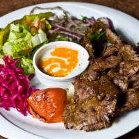 Doner Kebap · Combination beef and lamb, thinly sliced from the vertical grill.