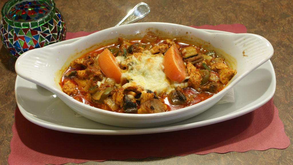Chicken Casserole · Mixed vegetables with diced chicken, baked in creamy sauce and served with rice.