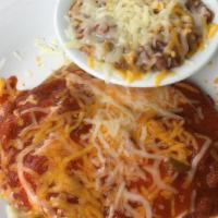 Huevos Rancheros · 2 over medium eggs on corn tortillas topped with homemade rancheros sauce.