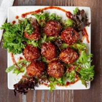 Bourbon Meatballs · Beef and pork meatballs slow-cooked in our mouthwatering bourbon BBQ sauce.
