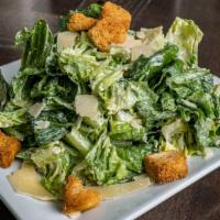 Caesar Salad · Crisp romaine lettuce tossed in our housemade Caesar dressing, then topped with shaved Parme...