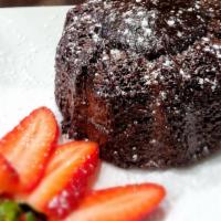 Chocolate Lava Cake  · A warm, fudgy chocolate cake with a molten dark chocolate center. Sprinkled with powdered su...