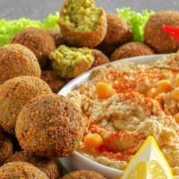Falafel Plate · Falafel served with warm pita bread, choice of rice or house salad and choice of 2 sides.