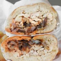 Hermosa Beach · Shredded chicken with grilled onions and our unique sauces, served hot on a roll.