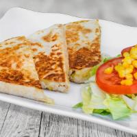 Spicy The Shack-A-Dilla · Our version of a chicken quesadilla with lots of chicken, cheese, tomatoes and our yellow sa...