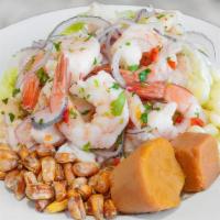 Ceviche Mixto · Fresh fish & jumbo shrimp, limes, onions, spicy peppers and cilantro served with peruvian co...