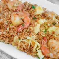 Shrimp Fried Rice · A generous 32 oz. Serving of peruvian style fried rice mixed with shrimp, eggs and green oni...