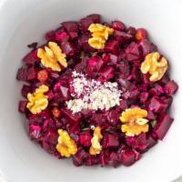 Beet Salad · Diced beets, onions, parsley, raisins, walnuts mixed with honey and balsamic vinegar.