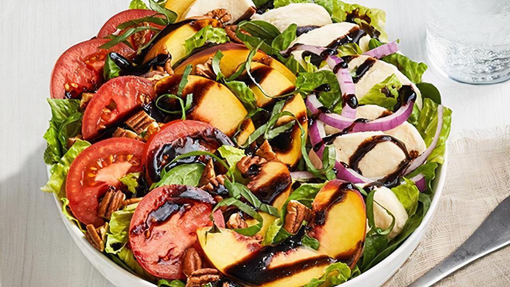 Peach Summer Salad · Spinach and Romaine lettuce, mozzarella cheese, red onions, Roma tomatoes, fresh peach slices and sprinkled with basil and pecans on the top. . *CONTAINS NUTS*