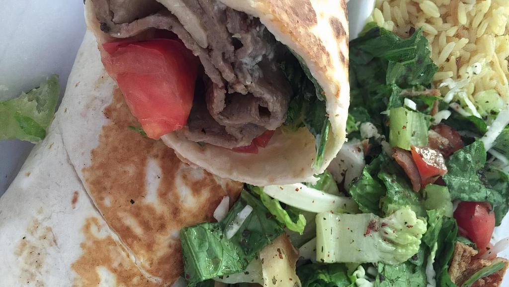 Gyros Wrap · Lettuce, Tomato, Gyro, and Garlic Sauce. Also comes with a side of Pilaf Rice and Fattoush Salad.