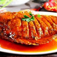 Deep Fried Tilapia · Fried whole fresh tilapia fish served with chili fish sauce.