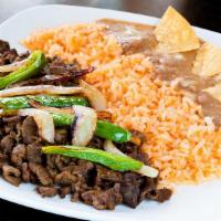 Asada Plate · Served with asada, grilled onions and jalapeño, rice, beans and three handmade tortillas.