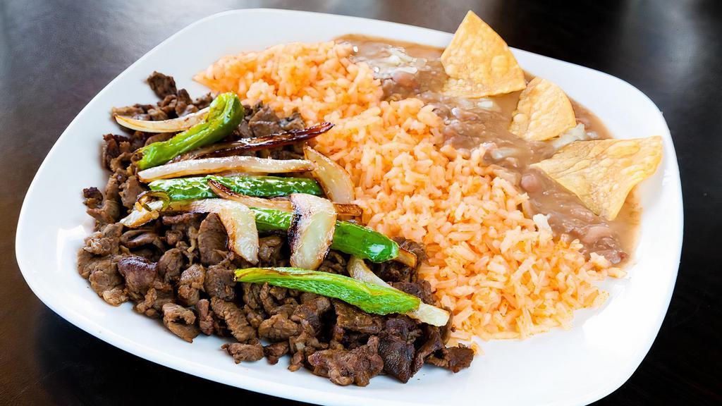 Asada Plate · Served with asada, grilled onions and jalapeño, rice, beans and three handmade tortillas.