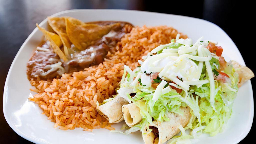 Taquito Plate · Served with three taquitos, (beef or chicken), lettuce, tomato, sour cream, guacamole, and rice and beans.