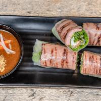 Nem Nướng Spring Rolls (2 Pieces) · Grilled seasoned pork patty, rice vermicelli, lettuce, bean sprouts, shredded mint and a fri...